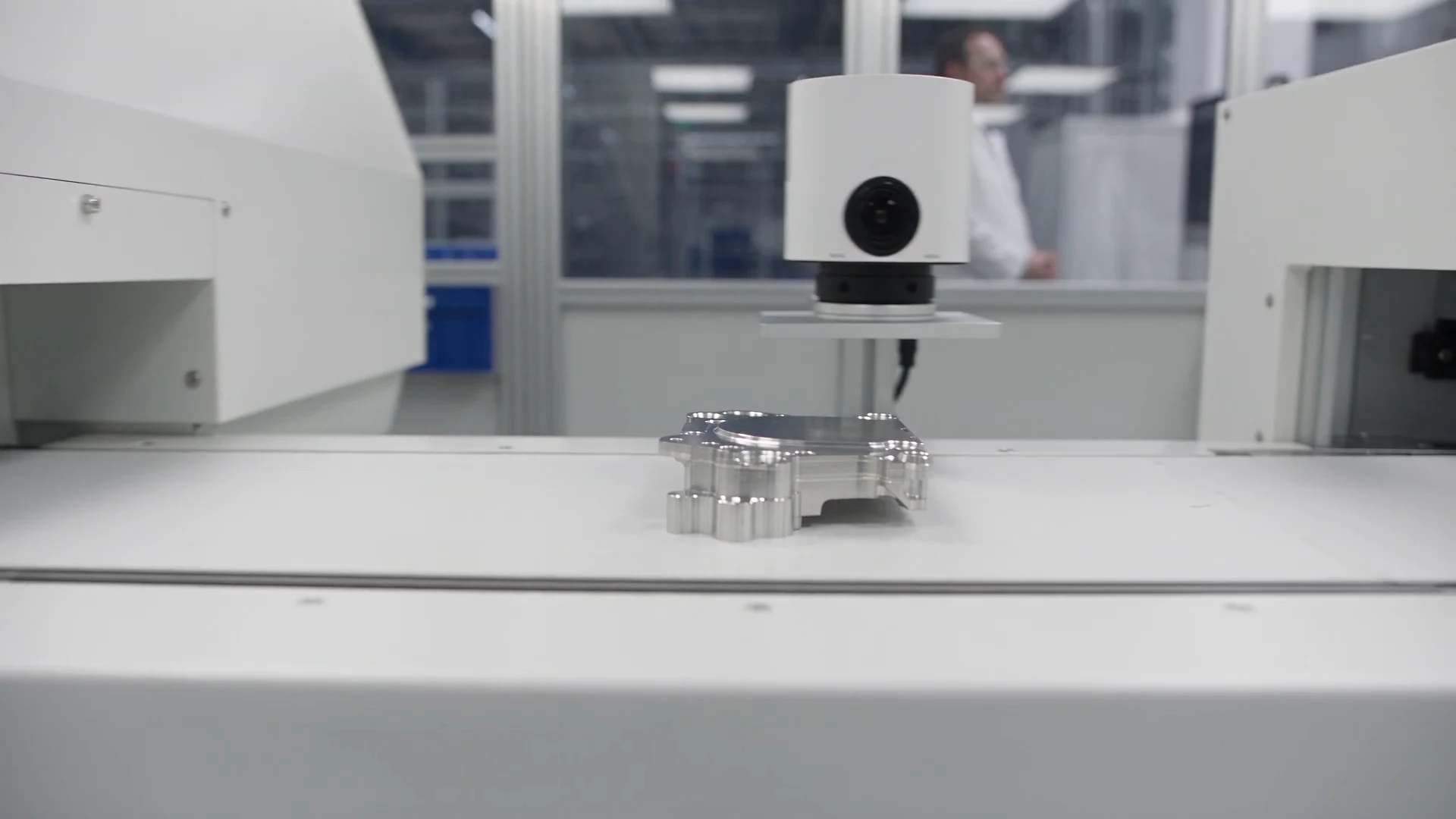 Bright precision assembly line with synchronized cameras and robotic part handling